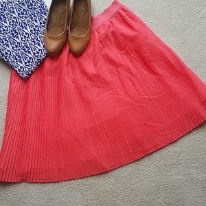 Coral pink pleated skirt